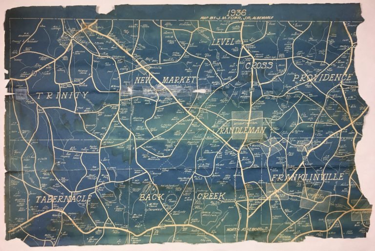 Damaged blueprint that is has been folded, creased and torn.